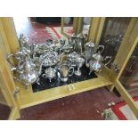 Shelf of silver plated tea & coffee pots etc