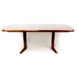 A 1960's rosewood and crossbanded 'Marlow' extending dining table of cushioned form,