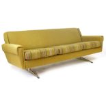 A 1960's fully upholstered sofa with striped cushions on chromed ski bases CONDITION