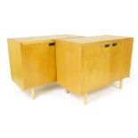 A pair of 1950/60's beech two door classroom cabinets, L. 95 cm, D.