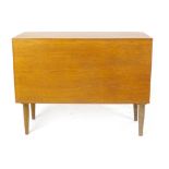 A Tapley 33 teak cabinet with a fall front, on circular tapering legs, l.