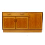 A G-Plan teak sideboard, the single drawer over three doors on a plinth base, l.