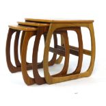 A nest of three G-Plan teak and crossbanded coffee tables on box ends, max. l.