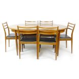 A G-Plan teak and crossbanded extending dining table, max. l.