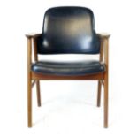 A 1970's teak framed and black vinyl desk chair CONDITION REPORT: Good for age