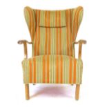 A 1950's oak and striped fabric wingback armchair on square straight feet CONDITION