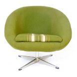 A 1960/70's green fabric swivel tub chair on a chromed four star base CONDITION REPORT: