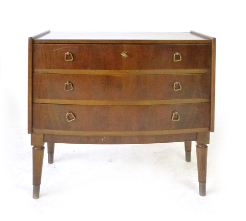 A 1970's walnut chest of three drawers on tapering feet, w.