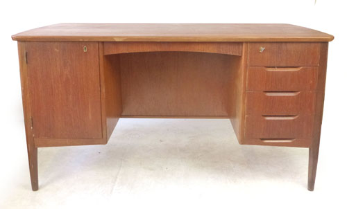 A 1970's teak and crossbanded desk,