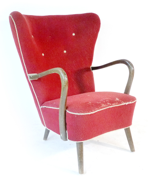 A 1940's red button upholstered and beech framed lounge armchair CONDITION REPORT: