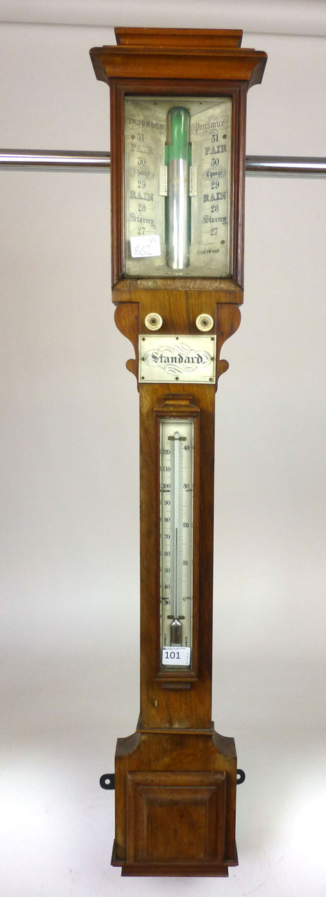 An early 19th century stick barometer with weather gauge and thermometer behind beveled glass along