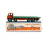 A Dinky Super Toys Fodden flatbed truck, number 502, with orange painted cab,