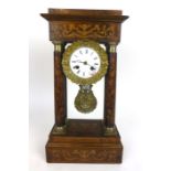 An early 19th century rosewood, marquetry and brass mounted eight day mantle clock,