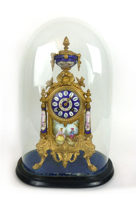 A 19th century French gilt metal and enameled eight day mantle clock under glass dome. h. 48 cm, w.