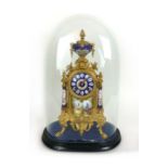 A 19th century French gilt metal and enameled eight day mantle clock under glass dome. h. 48 cm, w.