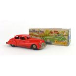 A Tri-ang Minic wind up plastic bodied model of a saloon car with red body,