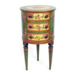 A circular French painted three drawer chest on square tapering legs with floral motifs on cream
