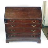 A large George III mahogany and boxwood line inlaid bureau,