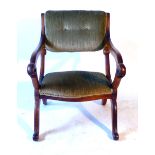 A Victorian satin birch metamorphic X-framed arm chair converting to a prayer chair with green