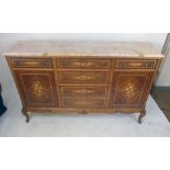 A Louis XV-style kingwood,