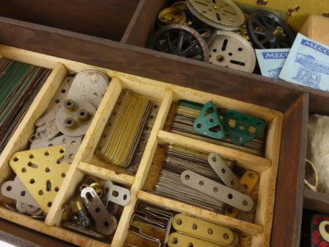 A lift top wooden storage box containing an assortment of various Meccano pieces to include wheels, - Image 2 of 10