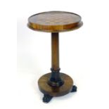 A William IV rosewood games table with satinwood and rosewood chess board top on a turned and