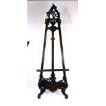 A modern mahogany easel, in the Rococo style with an adjustable shelf, h. 215 cm. w.