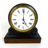 An early 19th century walnut and ebonised thirty hour mantle clock,
