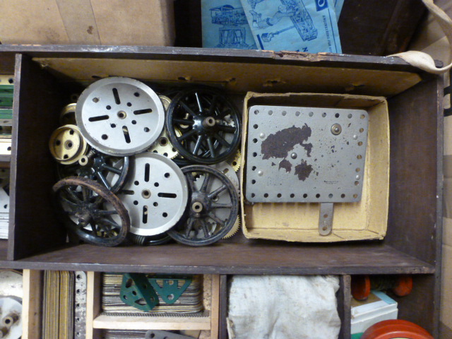 A lift top wooden storage box containing an assortment of various Meccano pieces to include wheels, - Image 4 of 10