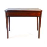 A Regency mahogany and ebony line inlaid tea table,