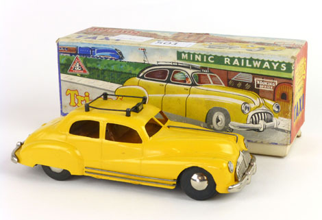 A Tri-ang number two Minic wind up taxi,