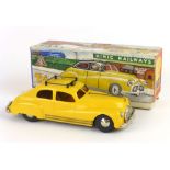 A Tri-ang number two Minic wind up taxi,