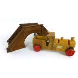 A scratch built wooden pull along train with tinplate wheels together with a selection of scenery,