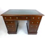 A Victorian mahogany pedestal desk with tooled green leather inserts,