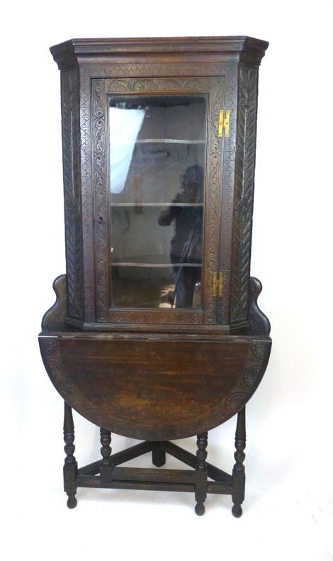 A late Victorian oak glazed corner cupboard on credence style table stand, h. 178 cm, w. 86 cm, max.