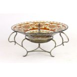 A late 19th century table centre, the pale cranberry glass bowl supported by a silver plated frame,