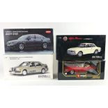 Four boxed one-eighteenth scale cars to include Jaguar E type, Auto Art Mercedes Benz,