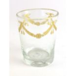 A late 18th/early 19th century drinking glass, gilt decorated with swags, h. 9.