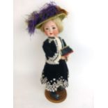 A Heubach Koppelsdorf German bisque headed doll, stamped 320.