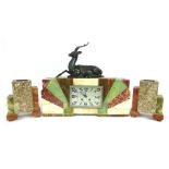 An Art Deco hardstone eight day mantle clock garniture with cast bronze deer to top above the metal