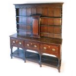 An early 18th century and later oak dresser,