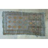 An Eastern hand woven prayer rug,