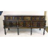 A 17th century-style oak sideboard, incorporating some 17th century drawer fronts,