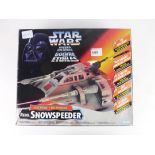 A 1995 Kennar Toys Rebel Snow Speeder in original box together with two 1995 Kennar pilots (3)