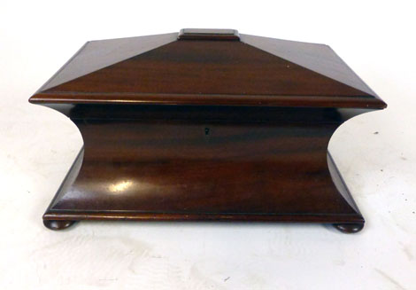 A Victorian mahogany concave sarcophagus tea caddy,