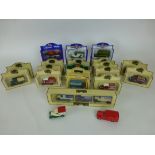 A collection of boxed Lledo days gone by vehicles to include Walkers crisps van etc together with
