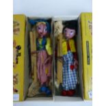 A boxed Pelham puppet, a SS Dutch boy in original box together with SS Dutch girl,