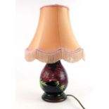 A Moorcroft table lamp base decorated in the 'Anemone' pattern, h.