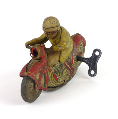 A Schuco sport tinplate clockwork motorcycle with rider, base colour of the motorcycle being red, - Image 2 of 3