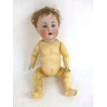 A ceramic bisque headed doll, stamped 201 Germany to back of head, with original brown wig,